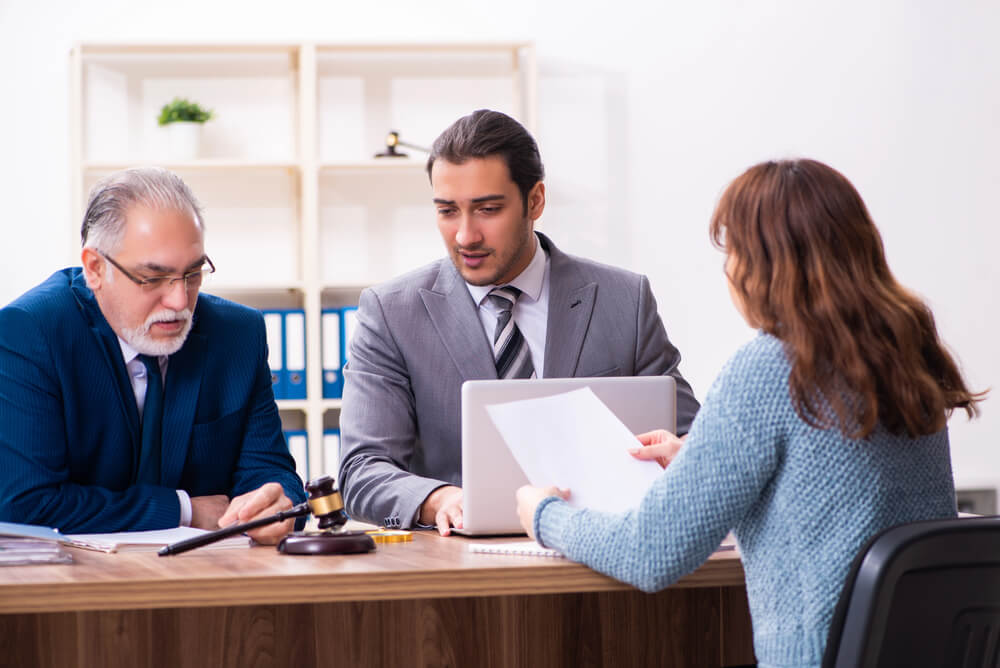 Woman talking to her lawyers